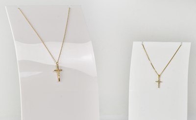 Lot 880 - A 14ct yellow gold cross pendant set with tiny...