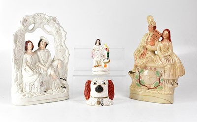 Lot 179 - Four Staffordshire figures, including a...