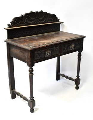 Lot 65 - A Victorian oak carved side table with shaped...