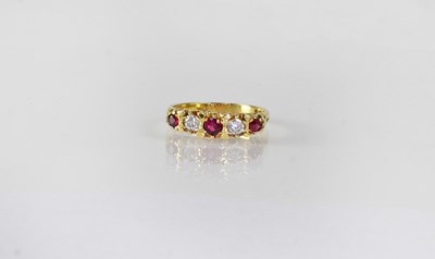 Lot 830 - An 18ct yellow gold ring set with three rubies...