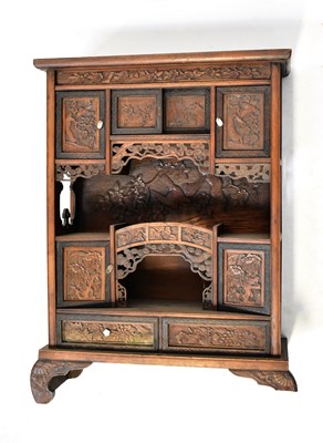 Lot 274 - A Meiji period table-top hardwood cabinet with...