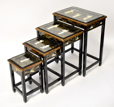 Lot 270 - A Chinese lacquered quartetto of tables, each...