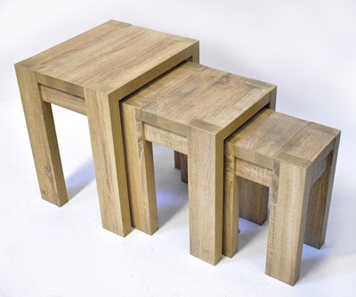 Lot 21 - A contemporary pale oak style nest of three...