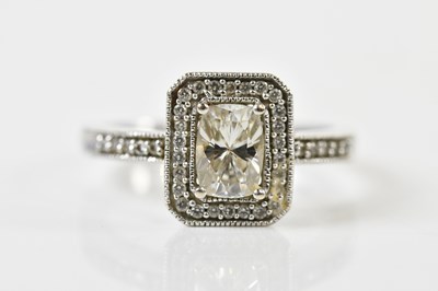 Lot 1277 - A 14ct white gold diamond ring, the central...