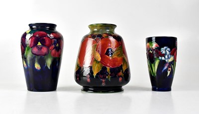 Lot 221 - MOORCROFT; three vases, comprising a...