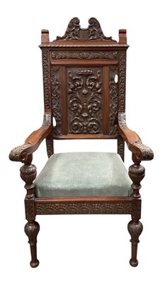 Lot 23 - A 19th century heavily carved walnut armchair,...