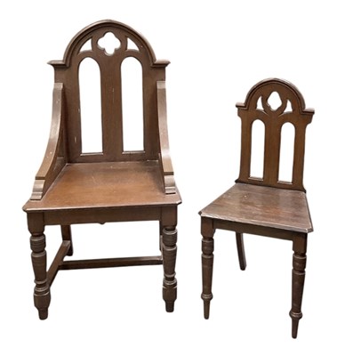 Lot 40 - Two oak Gothic style church chairs, the...