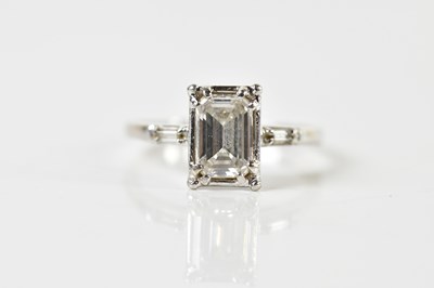 Lot 1273 - A platinum and diamond solitaire ring, the...