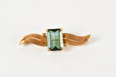 Lot 1248 - A yellow metal tourmaline brooch, with satin...