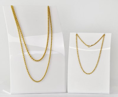 Lot 909 - Three 9ct yellow gold chain necklaces,...