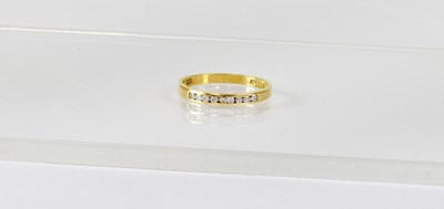 Lot 834 - An 18ct yellow gold half eternity ring set...