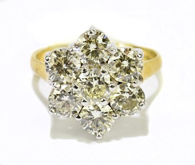 Lot 1006 - An 18ct yellow gold and diamond seven stone...