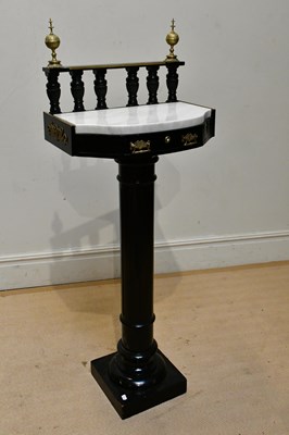 Lot 220 - A Victorian ebonised stand, with brass finials...