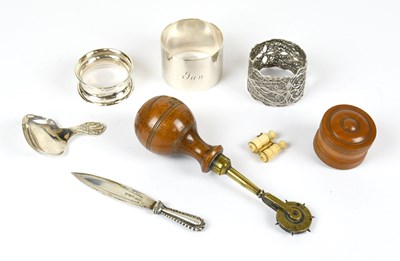 Lot 2559 - Two hallmarked silver napkin rings, the larger...