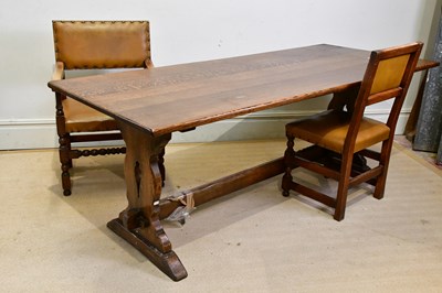 Lot 43 - A reproduction oak refectory dining table on...