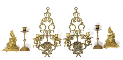 Lot 568 - A pair of pierced brass wall sconces with...