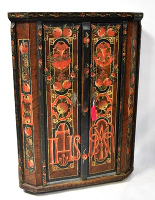 Lot 101 - A Continental painted hall cupboard decorated...