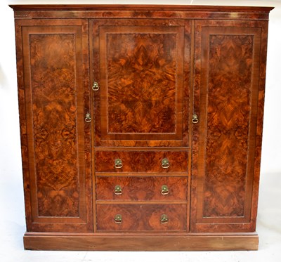 Lot 97 - A 1930s walnut Compactum wardrobe, two doors...