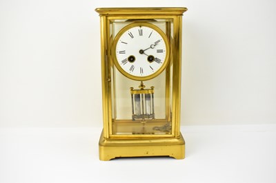 Lot 101 - A large French brass cased table clock, with...