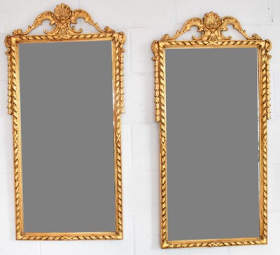 Lot 33 - A pair of reproduction ornate gilt framed...