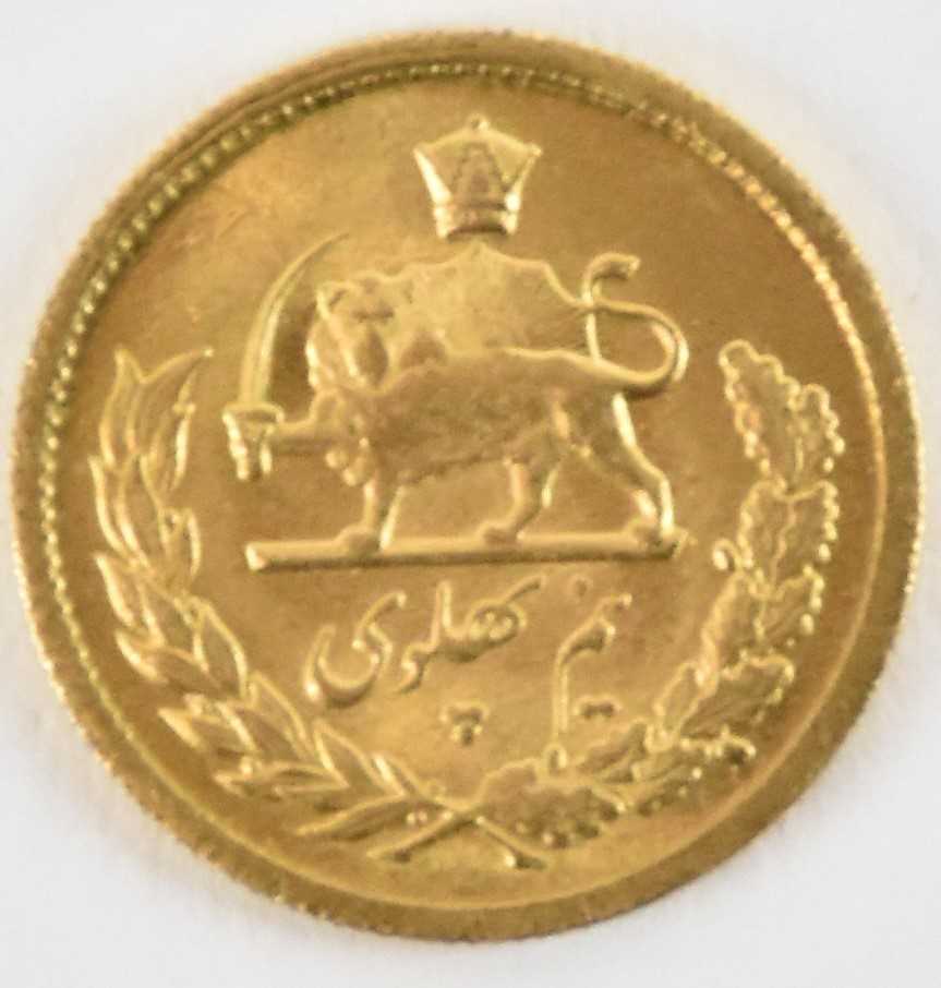 Lot 1586 - An Iranian 1/2 Pahlavi coin, with head of...