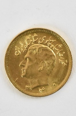 Lot 1586 - An Iranian 1/2 Pahlavi coin, with head of...