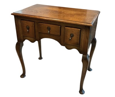 Lot 35 - A good quality oak reproduction lowboy, with...