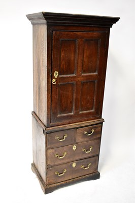 Lot 85 - An 18th century oak cupboard on chest of...