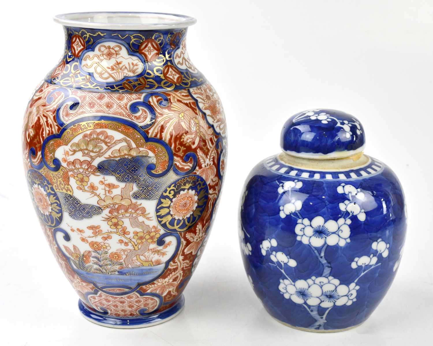 Lot 2077 - A Chinese blue and white prunus pattern ginger...