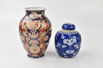 Lot 2077 - A Chinese blue and white prunus pattern ginger...