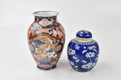 Lot 2077 - A Chinese blue and white prunus pattern ginger...