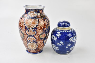 Lot 2077 - A Chinese blue and white prunus pattern ginger...