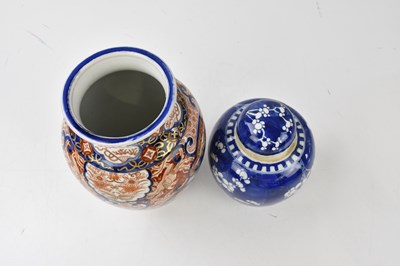 Lot 2077 - A Chinese blue and white prunus pattern ginger...