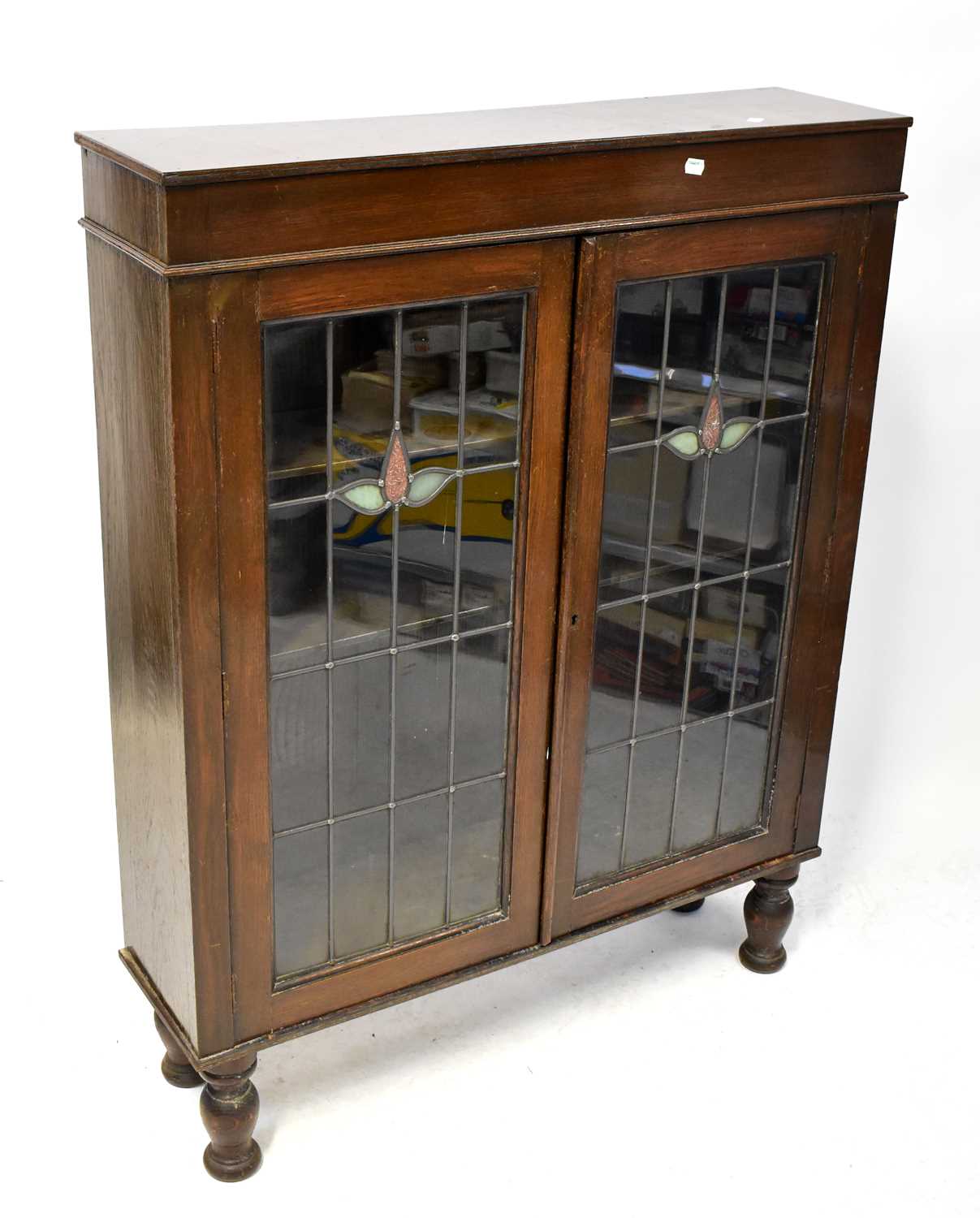 Lot 6 - A 1940s stained walnut display cabinet, with...