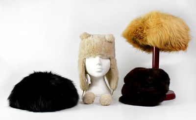 Lot 393 - Three fur hats, together with a faux fur hat...