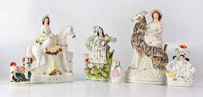 Lot 181 - A small group of Staffordshire figures...