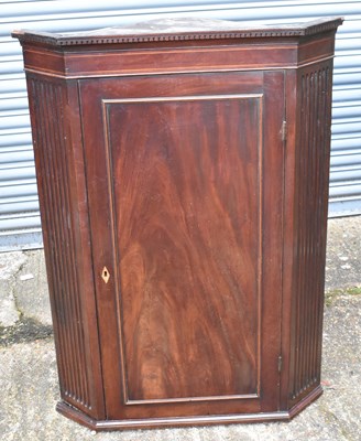 Lot 77A - A George III mahogany straight front wall...