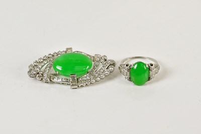 Lot 1233 - A white metal diamond and jade plaque brooch...