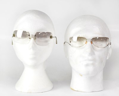 Lot 387 - CHANEL; two cased pairs of sunglasses, one...