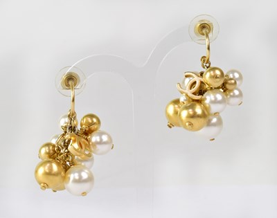 Lot 916 - A pair of pearl drop earrings with Chanel...