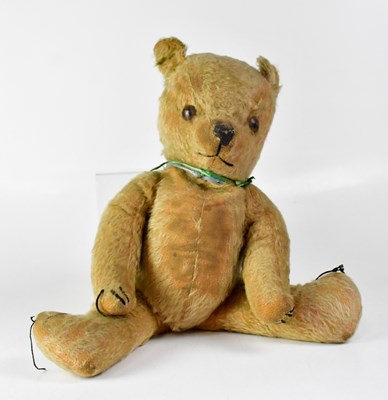 Lot 342 - A vintage plush teddy bear with plastic eyes,...