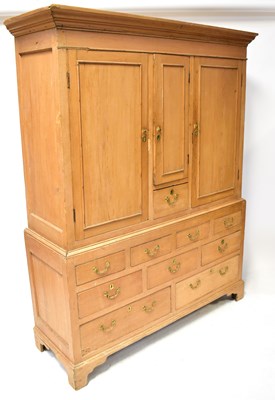 Lot 103 - A 19th century rustic pine linen cabinet, the...