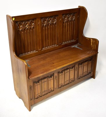 Lot 77 - A reproduction mahogany Gothic-style bench...