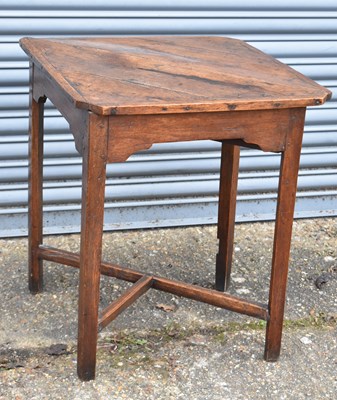 Lot 15 - A 18th century oak triangular drop-leaf corner...