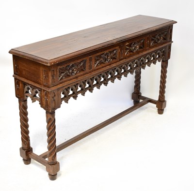 Lot 56 - A reproduction oak side table in the Gothic...