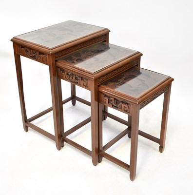 Lot 57 - A modern Chinese-style nest of three tables...