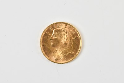 Lot 667 - A Swiss twenty franc 1949 gold coin, approx 6.5g.