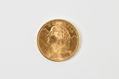 Lot 668 - A Swiss twenty franc 1947 gold coin, approx 6.5g.