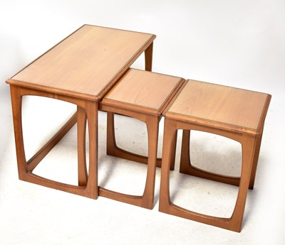 Lot 10 - A G-Plan style vintage teak nest of three...