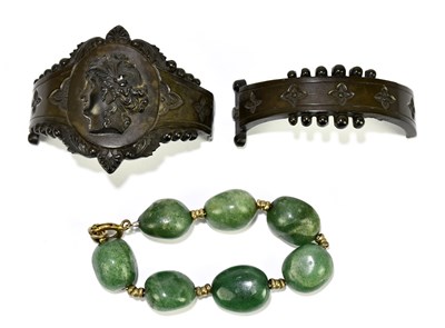 Lot 1280 - A Victorian carved jet two sectioned bangle...